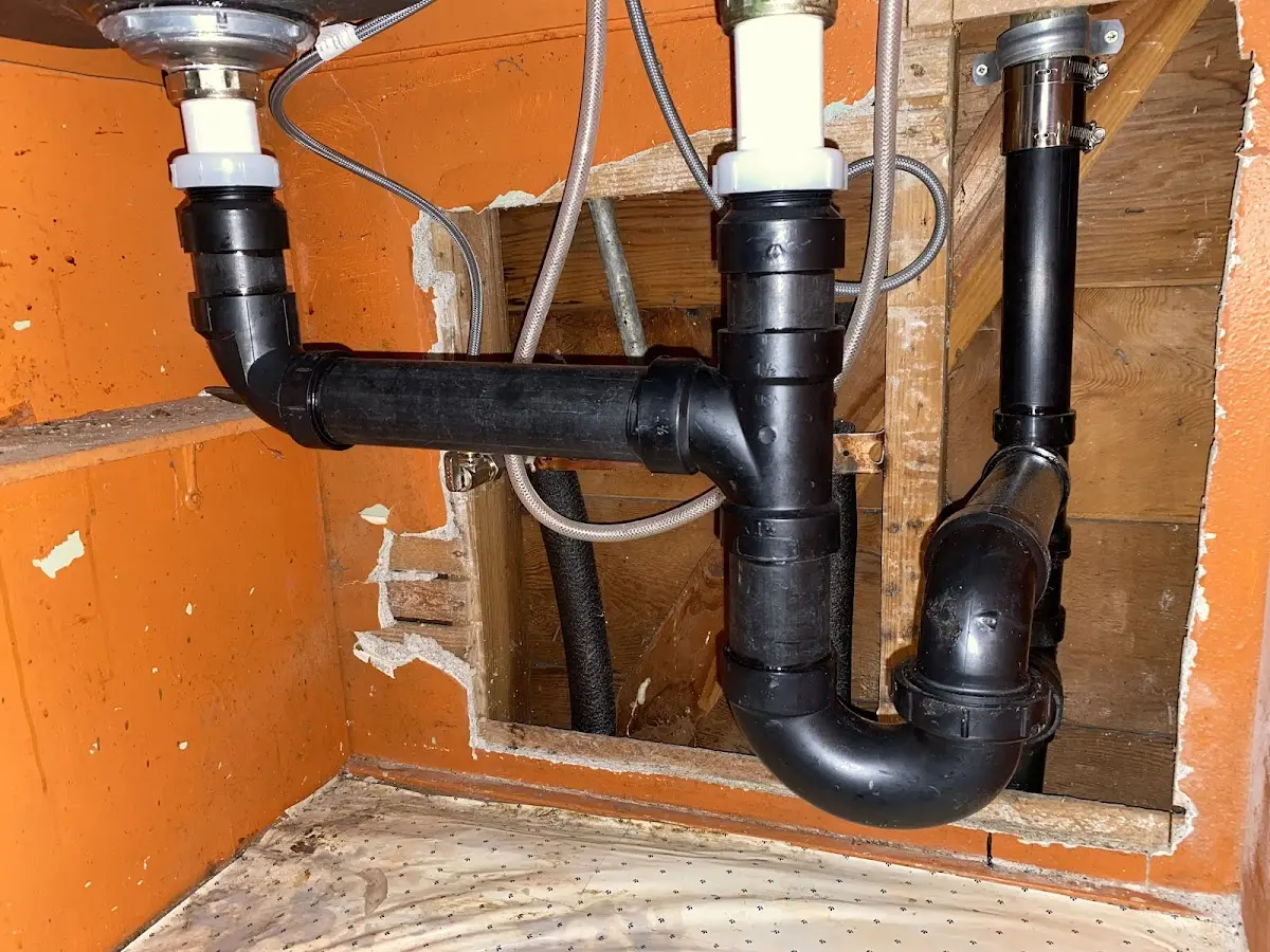 Professional Garbage Disposal Repair equipment and tools on the job in Millcreek